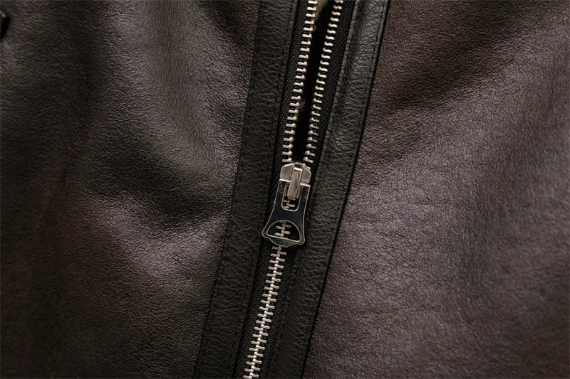 Women's leather winter jacket with vintage design and adjustable belt.